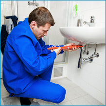 Man Repairing a Bathroom Sink - Water Jet Cutting